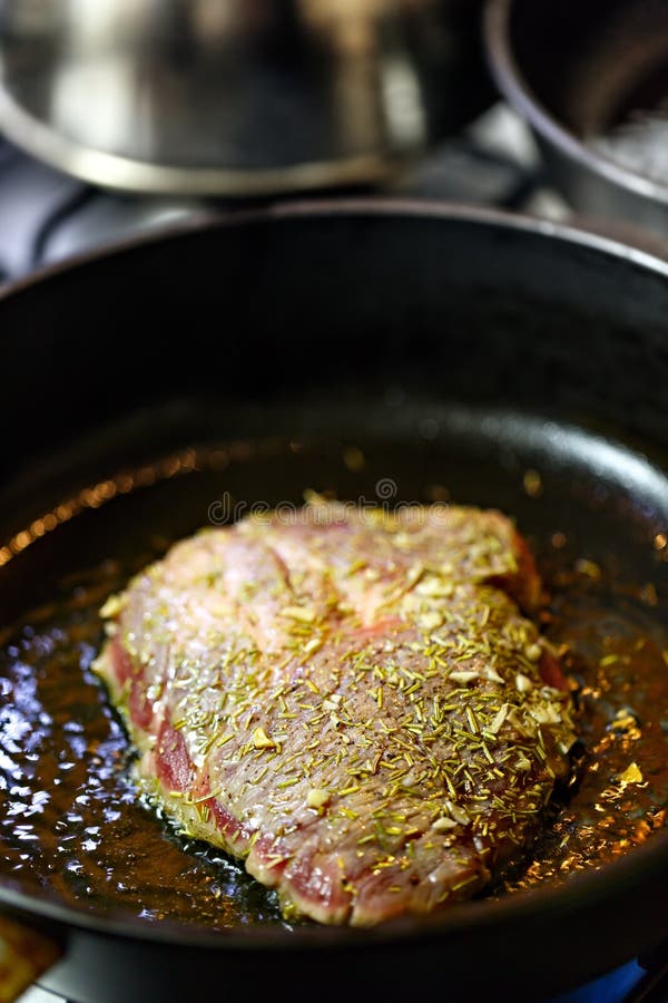 Beef steak fried in pan. stock image. Image of dinner 68804043