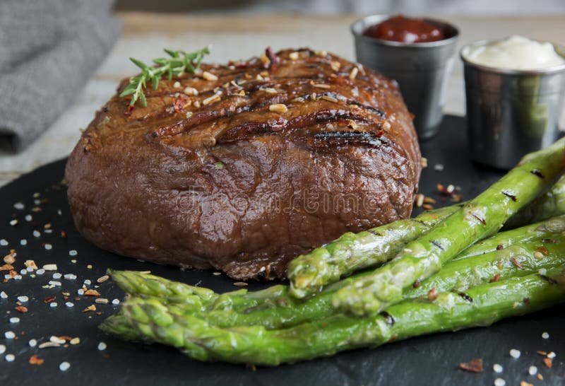 Beef Steak Grilled with Asparagus Tomatoes Spice and Sauce Stock Photo