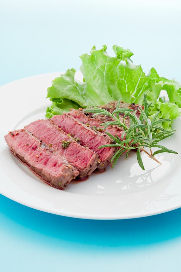 Beef steak with rosemary stock photo. Image of cooked 20669622