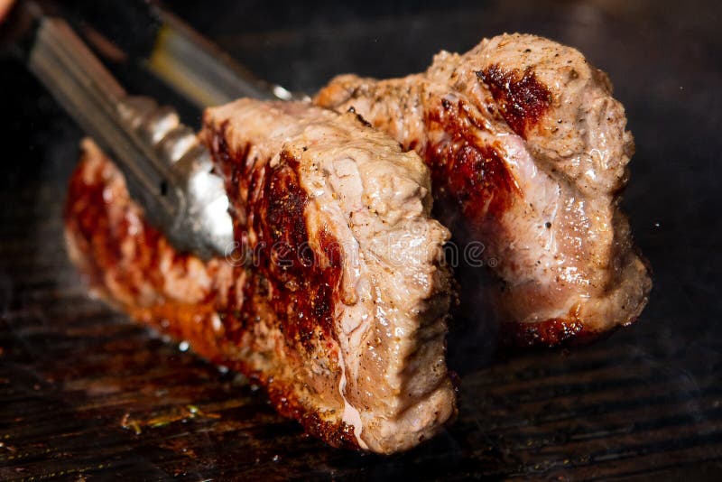 Beef steak on the stove stock photo. Image of steak 182357774