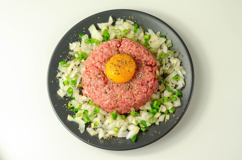 Beef Steak Tartare with Raw Egg Yolk and Onion with Chive Stock Photo