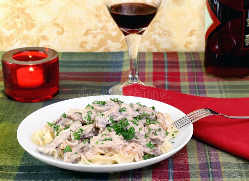 Beef Stroganoff and Egg Noodles Stock Image - Image of front, napkin