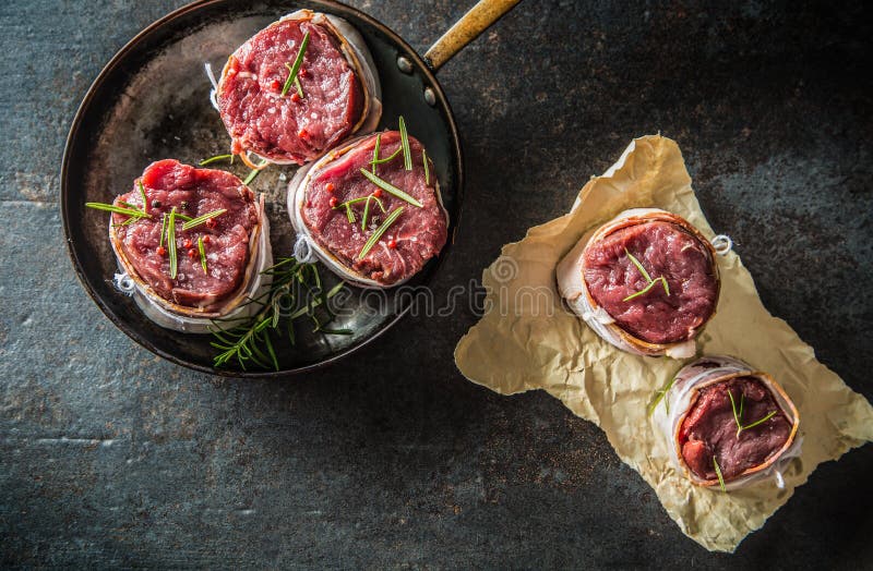 Beef Tenderloin Steak Wrapped in Bacon Stored into the Pan Stock Photo