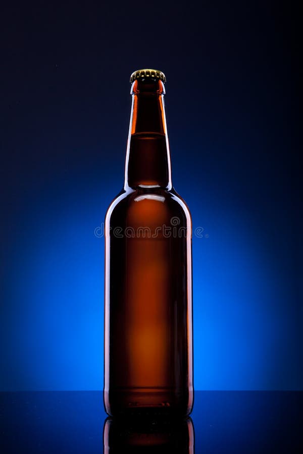 Beer bottle on blue background