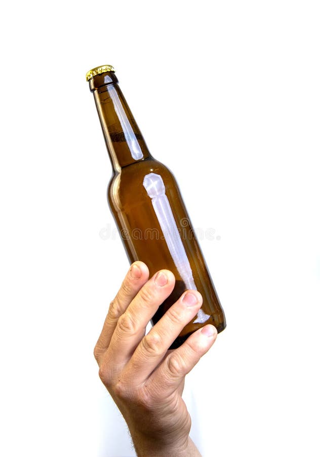 Beer Bottle in Hand Isolated on White. Stock Photo Image of brown
