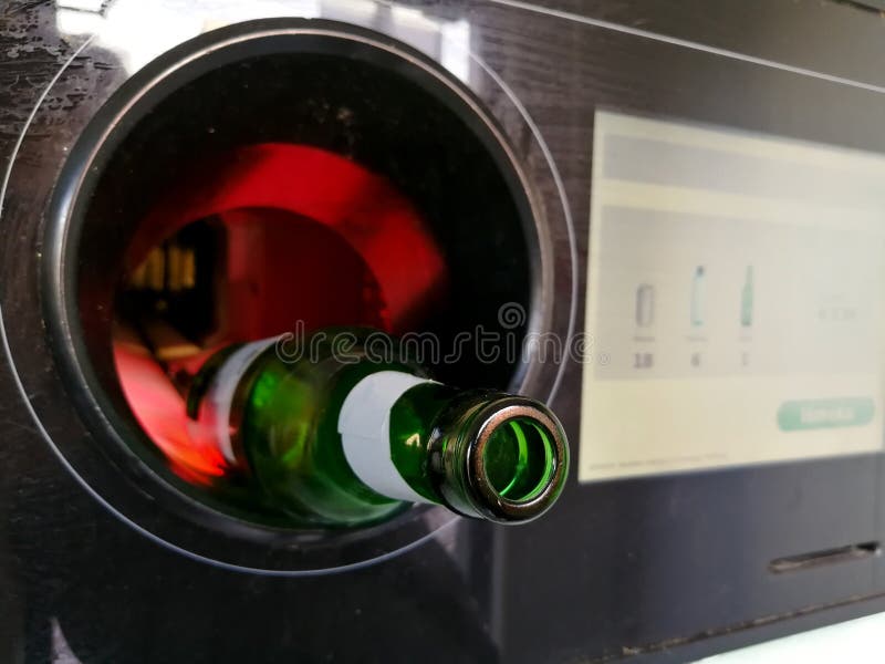 Beer Bottle Inserted in the Automatic Reverse Vending Machine for Recycling Stock Photo Image