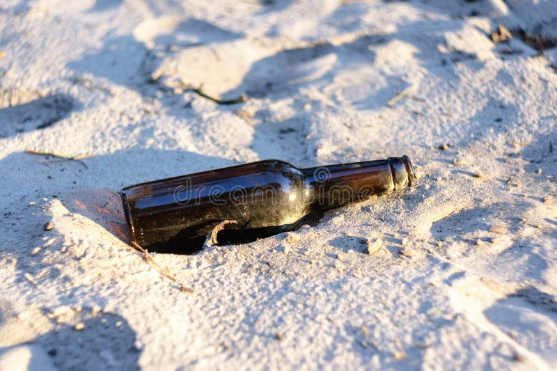 Beer bottle on the sand stock image. Image of land, pollution 95146547
