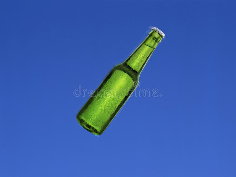 Beer Bottle Shot in the Air with Blue Sky Background. Beer Bottle on