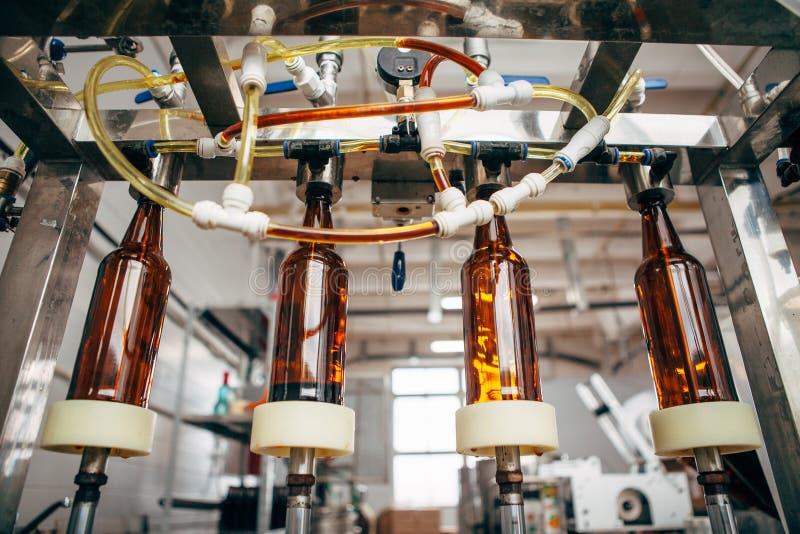 Beer Bottling Machine for Four Bottles in a Private Brewery Stock Photo