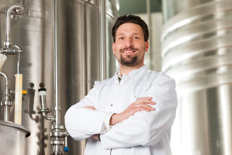 Beer brewer in his brewery stock photo. Image of profession 32481210