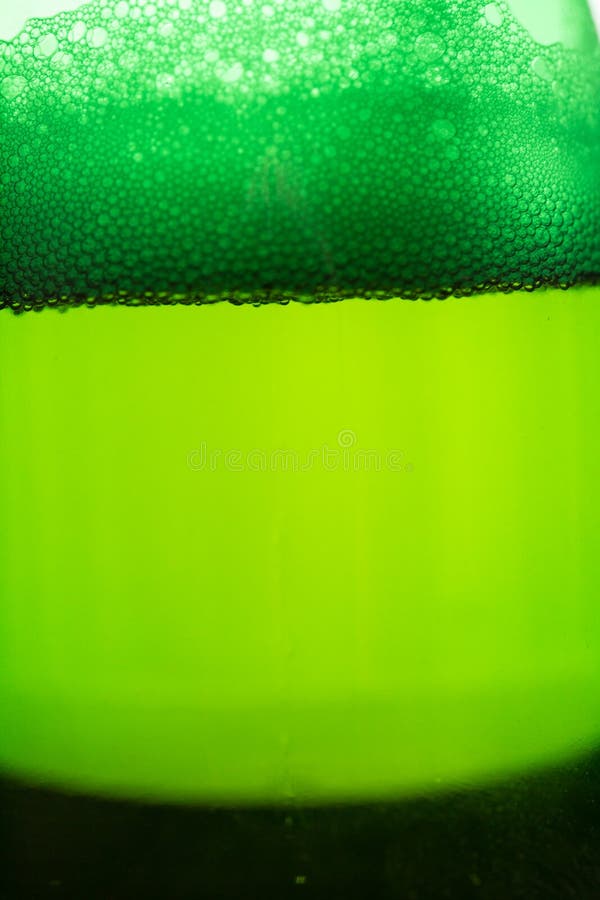 Beer with Bubbles and Foam in a Bottle Close Stock Image Image of