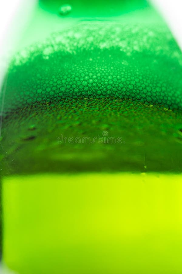 Beer with Bubbles and Foam in a Green Bottle Stock Photo Image of
