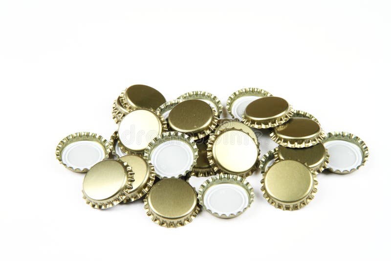 Golden beer bottle caps stock image. Image of closeup 6406613