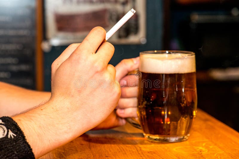 Beer and cigarette stock photo. Image of people, lifestyles 55460078