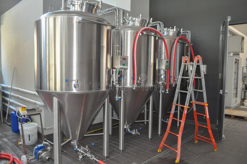 Beer fermenter in brewery stock image. Image of machinery 210369675