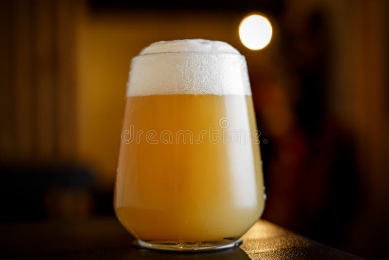 Beer glass in a bar stock image. Image of light, alcohol 209028221