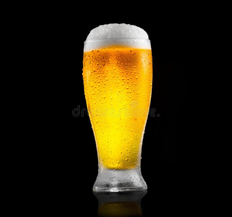 Beer. Glass of cold beer with water drops. Craft beer isolated on black