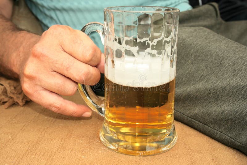 Beer in hand stock photo. Image of time, drink, break 11630950