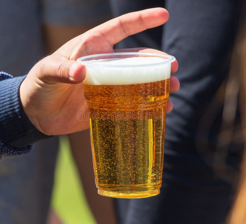 Beer in a Plastic Cup in Hand Stock Photo Image of summer, liquid
