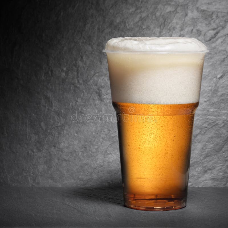 Closeup Of A Glass Of Beer On A White Background Stock Photo - Download  Image Now - Beer - Alcohol, Disposable Cup, Plastic - iStock