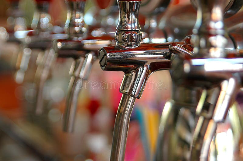 Chrome beer taps in line