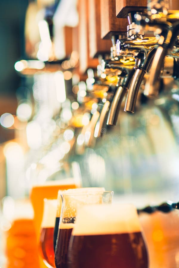 Beer taps in a pub stock photo. Image of golden, club - 110561470