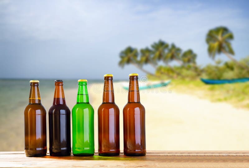 Beer on Wooden Table on Blurred Beach Background, Mock Up Stock Image ...