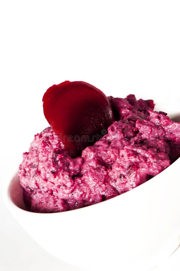 Close up of a bowl with pink beetroot dip. Close up of a bowl with pink beetroot dip