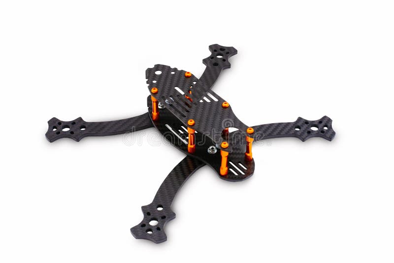 The beginning of the racing drone assembly. A robust frame of an unmanned aerial vehicle made of carbon fiber. Frame of carbon fib stock photos The beginning of the racing drone assembly. A robust frame of an unmanned aerial vehicle made of carbon fiber. Frame of carbon fib stock photos