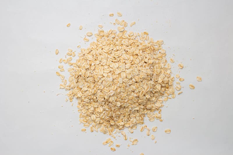Concept of healthy grain, Oat flakes or oats cereal is piled on the floor. Concept of healthy grain, Oat flakes or oats cereal is piled on the floor.