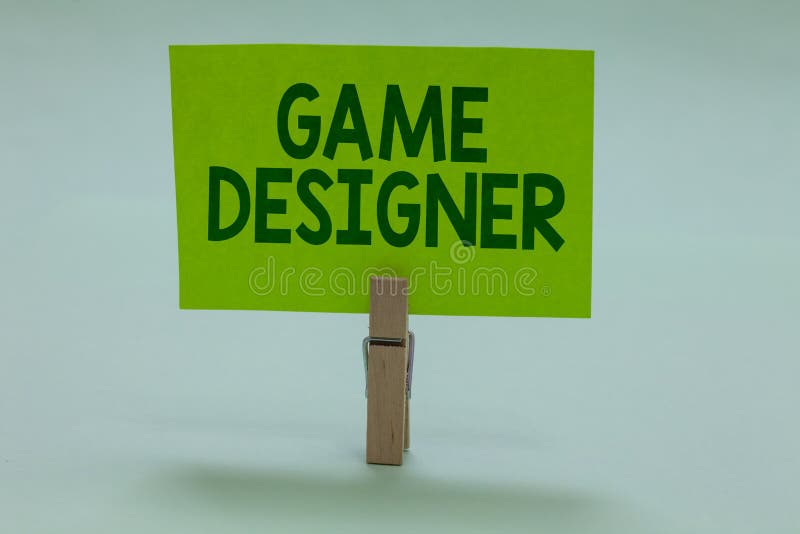 Conceptual hand writing showing Game Designer. Business photo showcasing Campaigner Pixel Scripting Programmers Consoles 3D Graphics Clothespin holding green paper important message ideas. Conceptual hand writing showing Game Designer. Business photo showcasing Campaigner Pixel Scripting Programmers Consoles 3D Graphics Clothespin holding green paper important message ideas