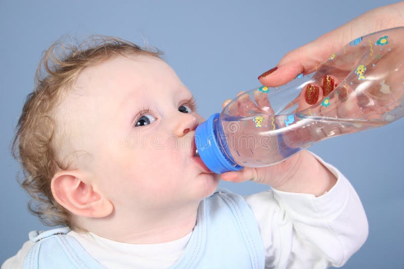 Baby drink water from bottle. Baby drink water from bottle