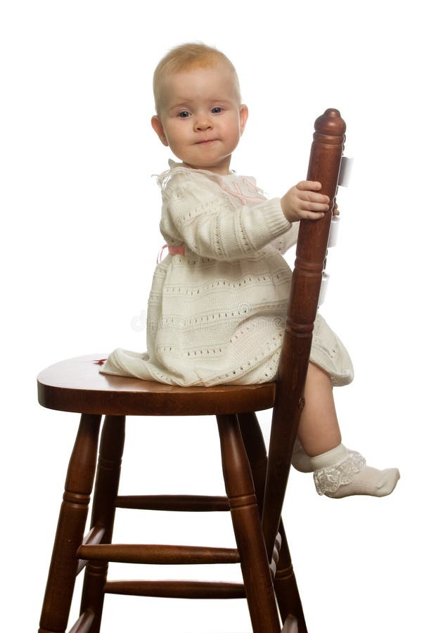 Baby sit on woden chair. Baby sit on woden chair.