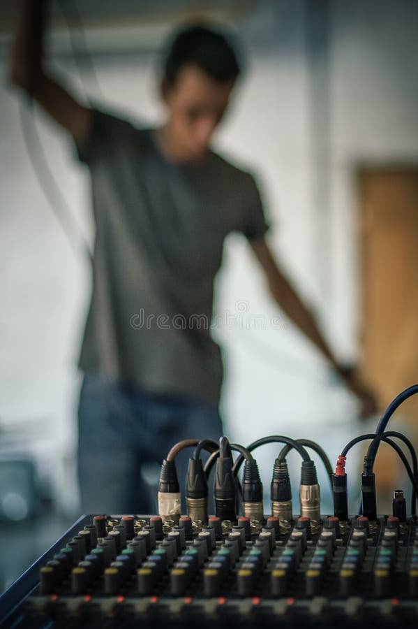 Behind the Scene. Sound Technician Electric Engineer Adjusting Sound