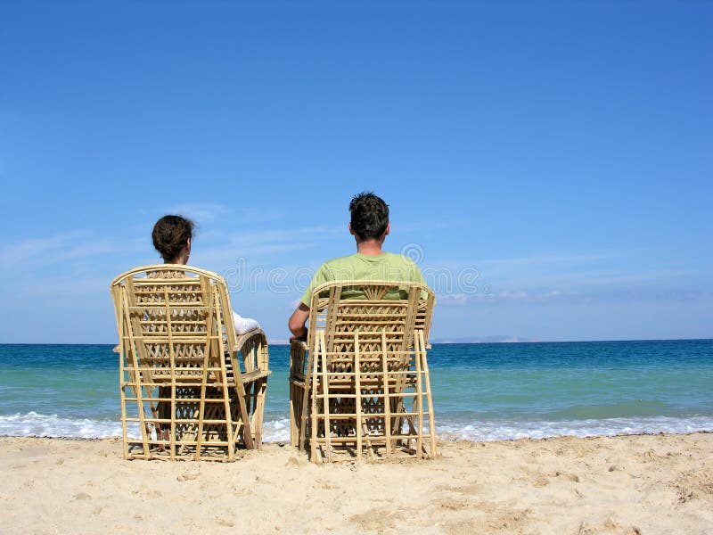 Behind sitting couple on beach 2