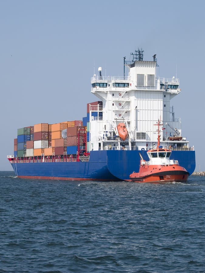 Huge container cargo ship heading for port. Huge container cargo ship heading for port