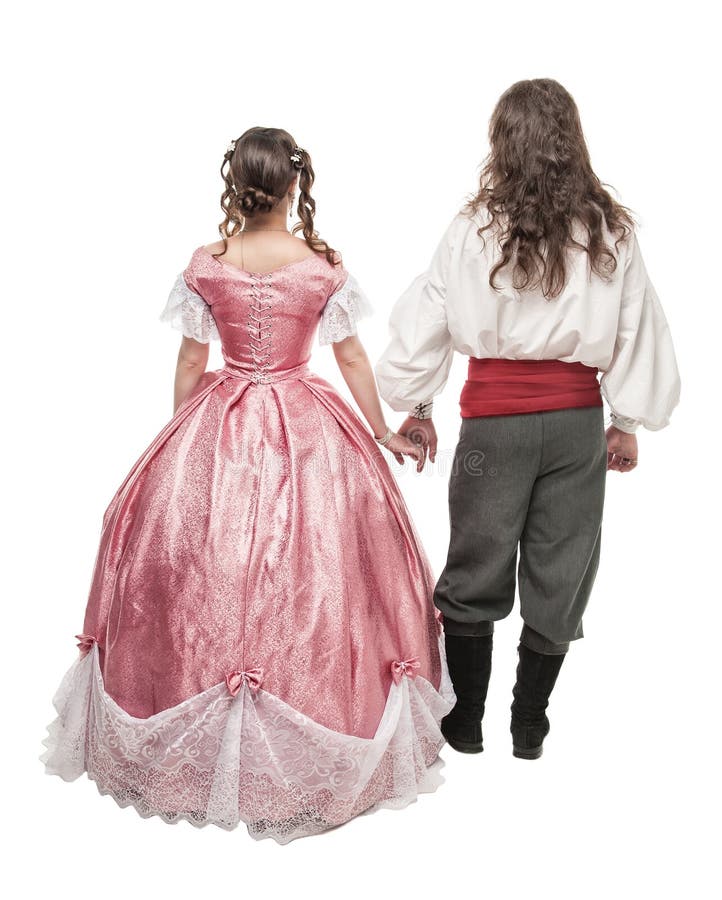 Bei donna ed uomo delle coppie in vestiti medievali Posa posteriore immagini stock Bei donna ed uomo delle coppie in vestiti medievali Posa posteriore immagini stock