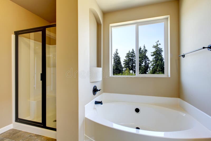  Beige  Bathroom  Interior With White Bath Tub  And Glass 