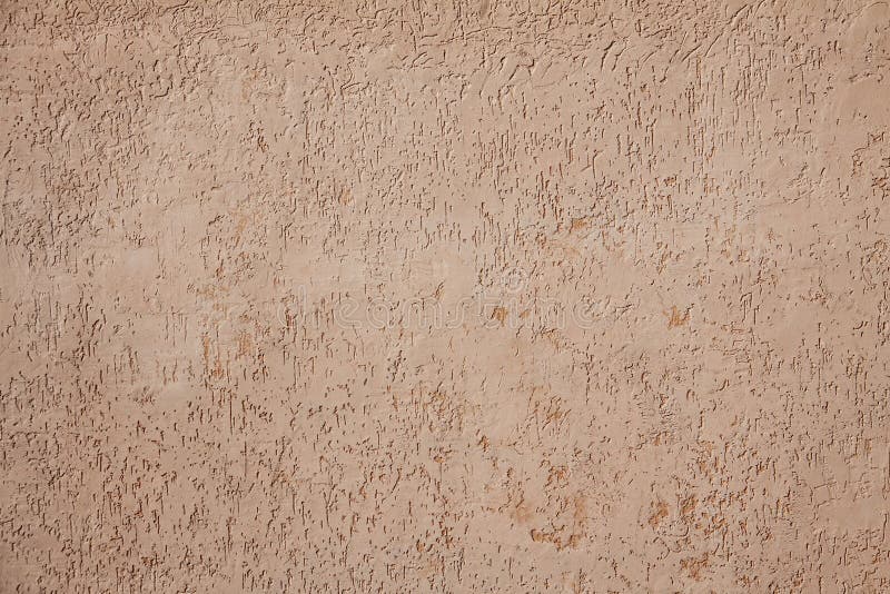 Beige cement plaster wall as background or texture. stock image