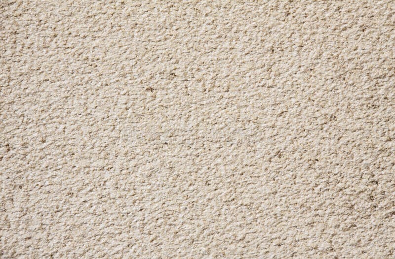 Beige cement plaster wall as background or texture. stock photography