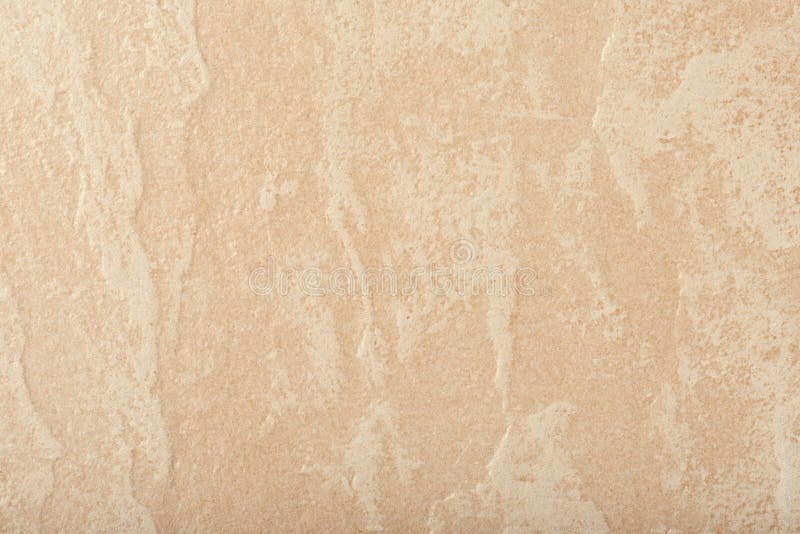 Beige Ceramic Tile on the Wall in the Bathroom. Background from Beige