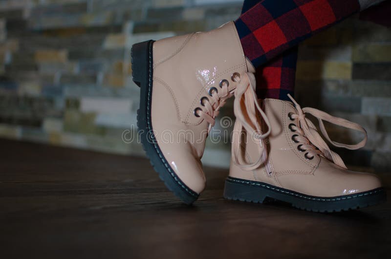 Children Shoes, Against the Background of a Stone Wall Stock Image