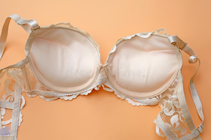 https://thumbs.dreamstime.com/b/beige-lace-bra-push-up-orange-background-inner-side-fashion-lingerie-concept-beautiful-bone-lace-brassiere-wrong-side-big-183931634.jpg