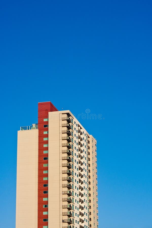Beige and Red Condo Tower Rising into Blue Sky Stock Image Image of