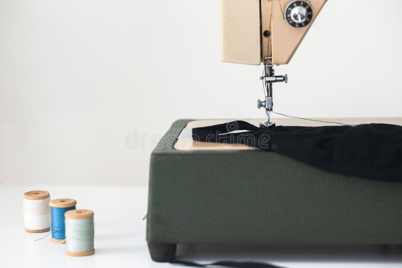 Beige sewing machine the process of sewing a protective medical mask at home is handmade royalty free stock image Beige sewing machine the process of sewing a protective medical mask at home is handmade royalty free stock image