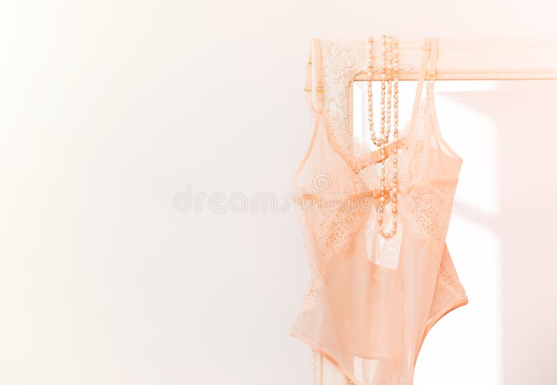 Young multicultural women bodies wear underwear on beige background, close  up. Stock Photo by insta_photos