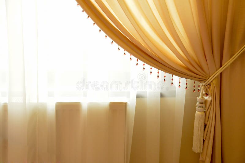 Beige venstergordijn royalty-vrije stock foto Beige venstergordijn royalty-vrije stock foto