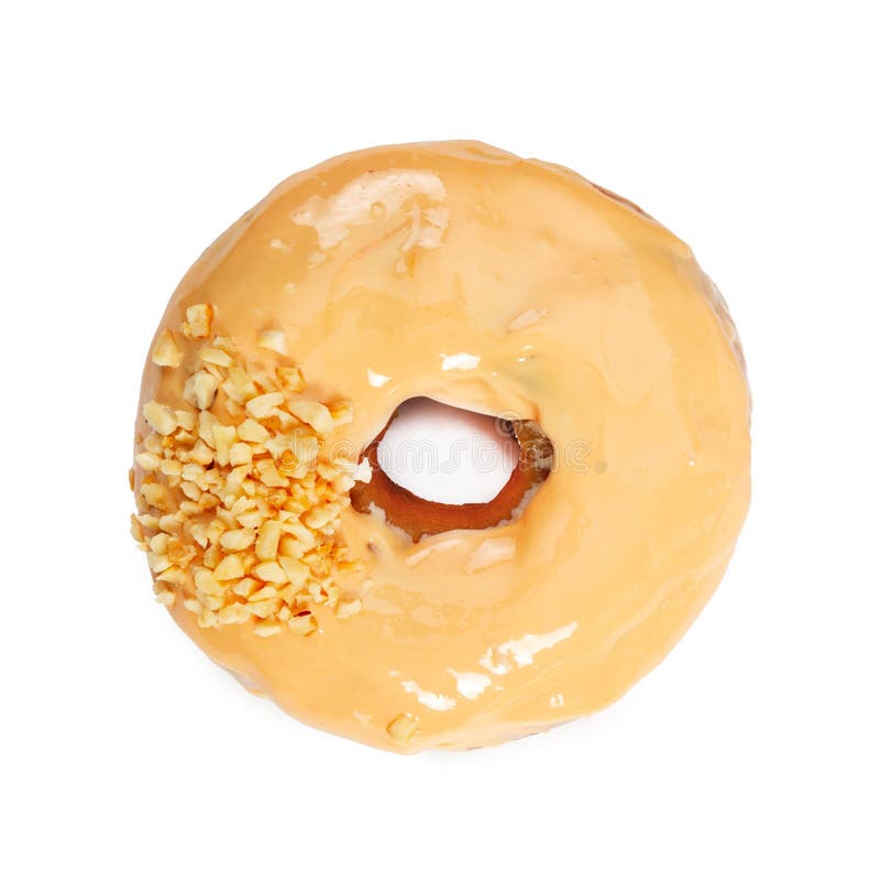Beignet avec le gla?age et les ?crous de caramel d'isolement sur le blanc images stock Beignet avec le gla?age et les ?crous de caramel d'isolement sur le blanc images stock