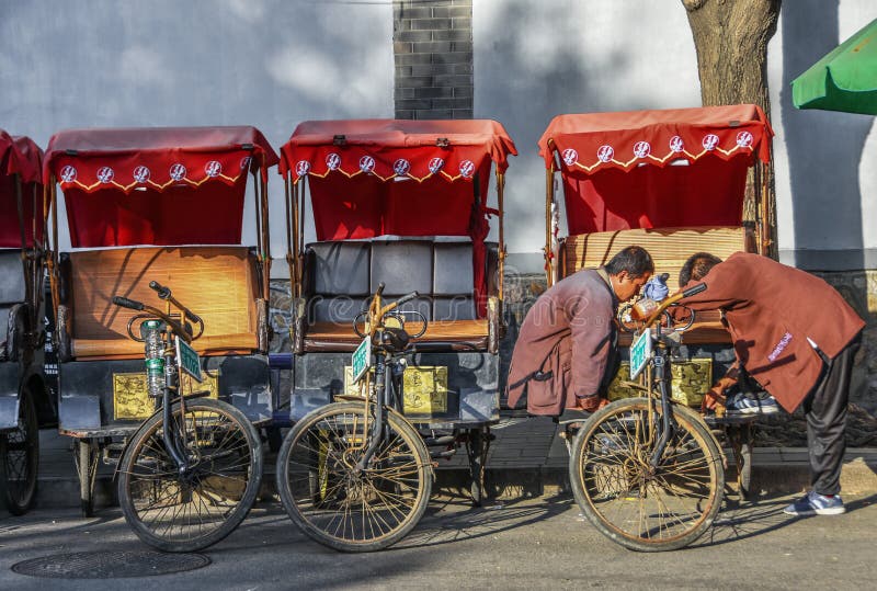 Beijing, 7th May Row of Tricycles with Red Cab from the Wangzuo Hutong