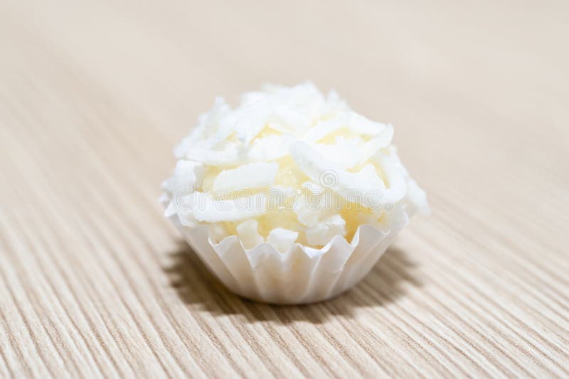 Beijinho is a handmade candy from Brazil. Made with condensed milk and coconut. Children brithday party sweet. Overhead of candy b royalty free stock photos Beijinho is a handmade candy from Brazil. Made with condensed milk and coconut. Children brithday party sweet. Overhead of candy b royalty free stock photos